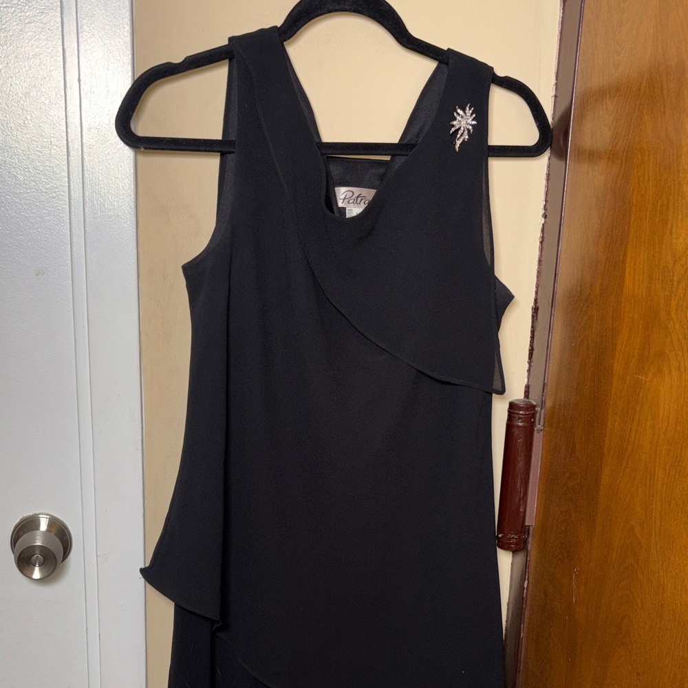 Patra Black Sleeveless Midi Dress with Decorative Brooch